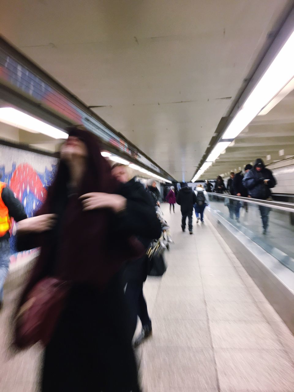 large group of people, women, men, real people, walking, indoors, city life, illuminated, commuter, people, day, adult