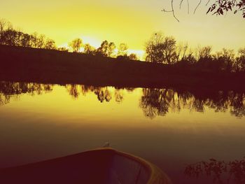 Scenic view of lake at sunset