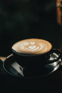 Close-up of cappuccino on table