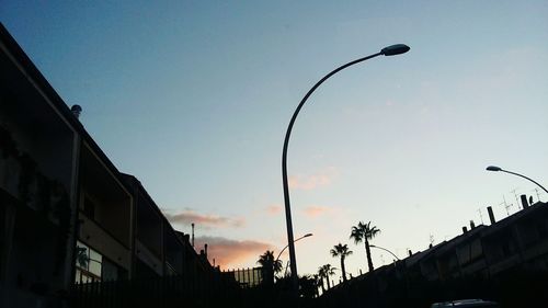 Low angle view of street light against sky