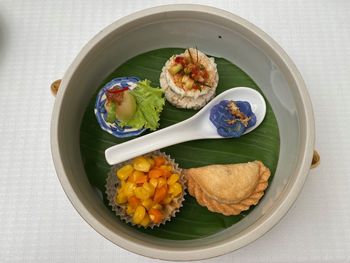 High angle view of fruits in plate on table