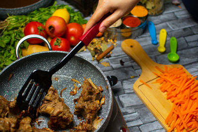 Midsection of man preparing food