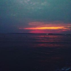 Scenic view of sea against sky at sunset