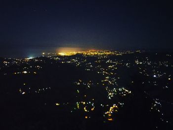 Illuminated cityscape at night