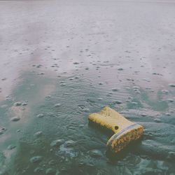 High angle view of yellow floating on water