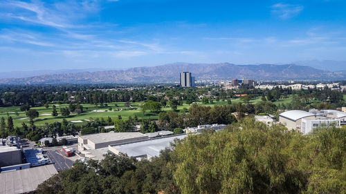 High angle view of buildings in city against sky