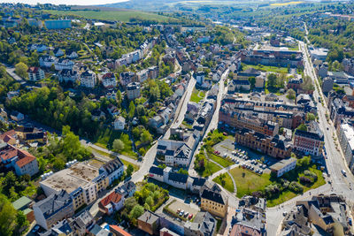 High angle view of street amidst buildings in city