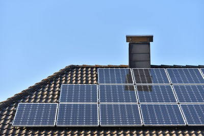 Solar panels installed on the roof of a house with tiles in europe 