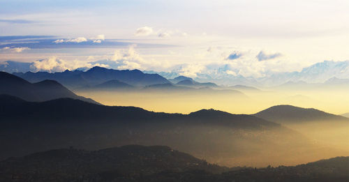 Scenic view of mountains against sky during sunset