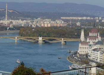 High angle view of bridge over river and buildings in city, margaret island and bridge