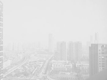 Aerial view of cityscape against sky
