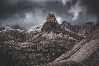 Low angle view of mountain against dramatic sky