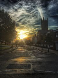 View of city street at sunset