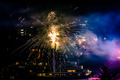 Firework display at night