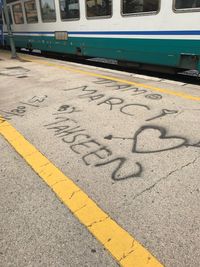 Text on train at railroad track