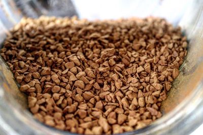 Close-up of crushed coffee beans in container