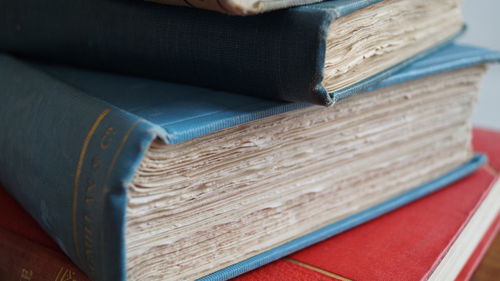 Close-up of stacked hardcover books