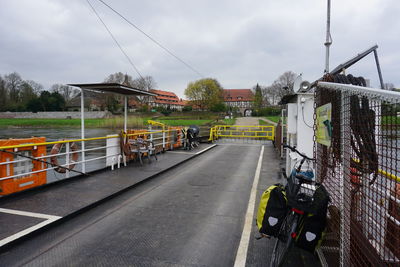 Road by city against sky
