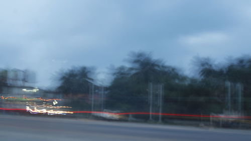 Blurred motion of car on road in city