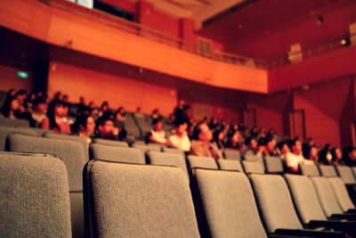 Low angle view of people in auditorium