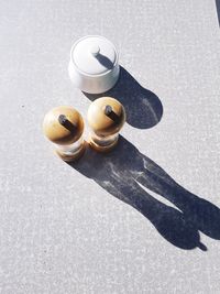 High angle view of drinking glasses on table