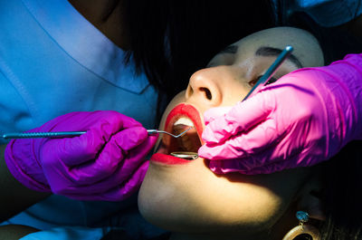 Midsection of woman working in purple