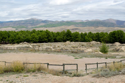 Scenic view of farm against sky