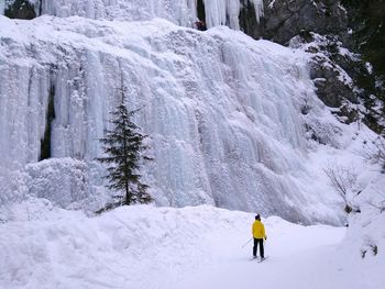 Man skiing on snow covered mountain