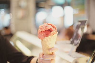 Close-up of hand holding ice cream