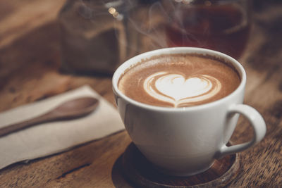 Close-up of cappuccino on table