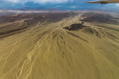 Aerial view of desert against sky