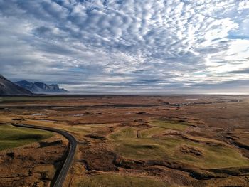 View of landscape against cloudy sky