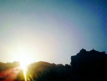 Silhouette of building at sunset