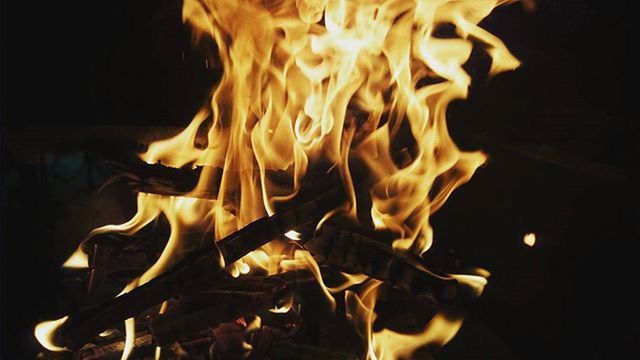 CLOSE-UP OF FIRE IN THE DARK