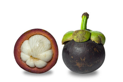 Close-up of fruits against white background