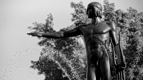 Low angle view of statue against sky