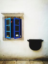 Low angle view of window on wall of building