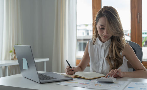 Businesswoman working at office