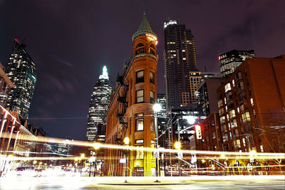 Illuminated buildings in city at night