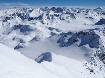 Scenic view of snow covered mountains