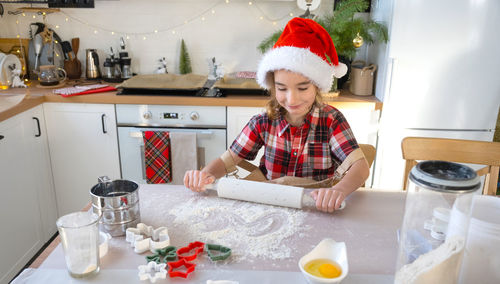 Portrait of young chef preparing food in kitchen