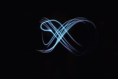 Close-up of light painting against black background