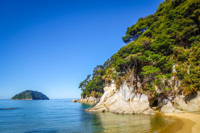 Scenic view of sea against clear blue sky