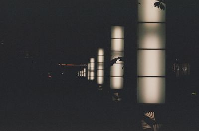 Illuminated building against sky at night