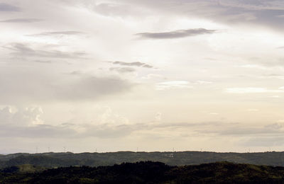Scenic view of landscape against cloudy sky