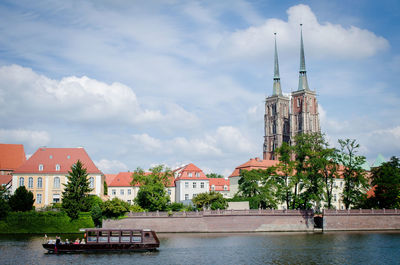 View of buildings against cloudy sky in wroclaw