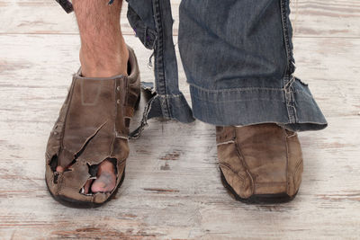 Low section of man standing on floor