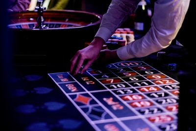 Midsection of person playing piano