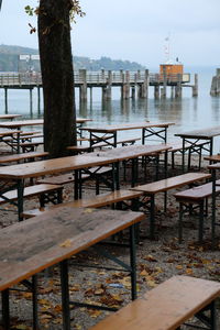 Chairs and table against sky
