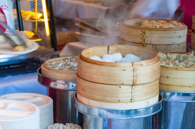 Hot steamed dumplings cooked on bamboo basket steamer in restaurant